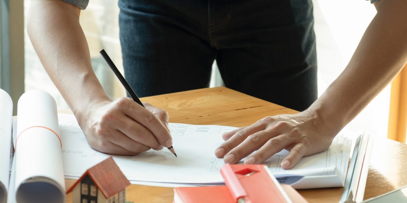 Architects write home designs on the desk.